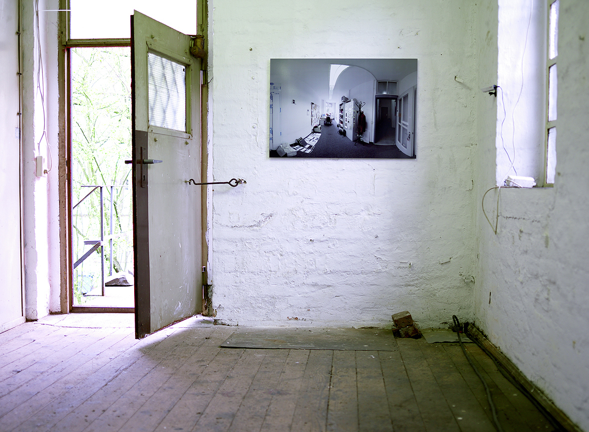 another view of the installation showing a wall photo near the doorway