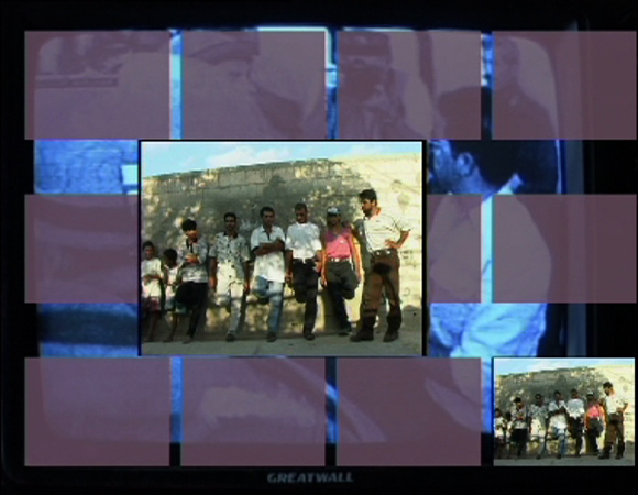 a frame showing a group of young palestinian men