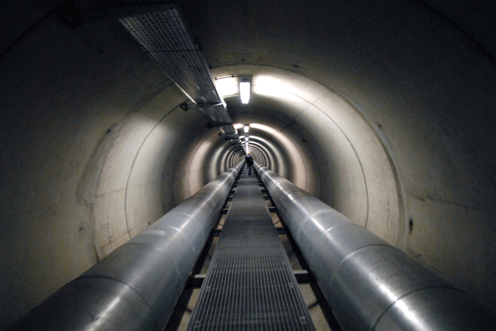 a grey and metal district heating tunnel